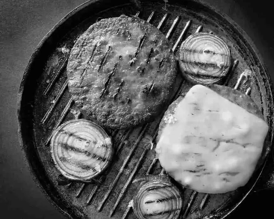 Pan with burger patties made from alternative proteins