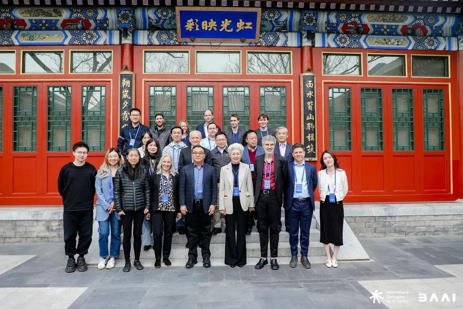 Group photo of international AI researchers in front of a traditional Chinese building in Beijing