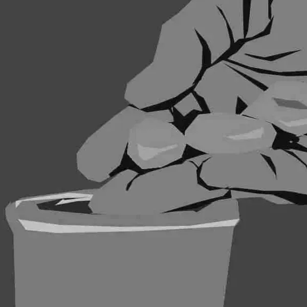 A hand drops a coin into a donation cup